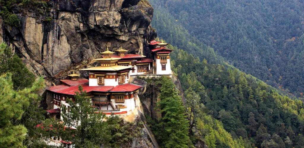Bhutan Monasteries and mountains amongst a lush, untouched green paradise.