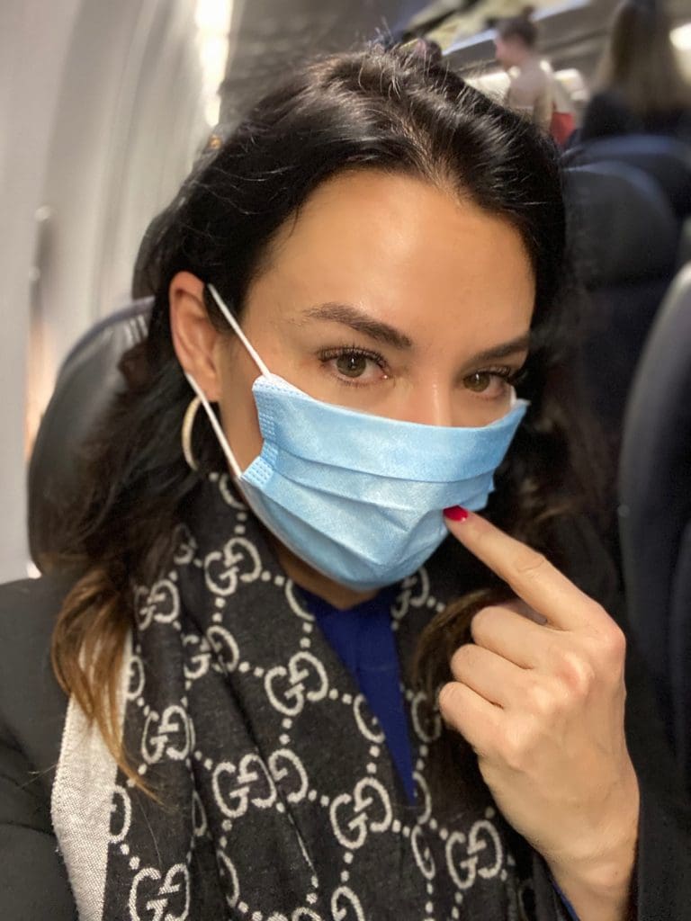 Face masks arrive in a Care Pack from Qantas. Most passengers have them on.