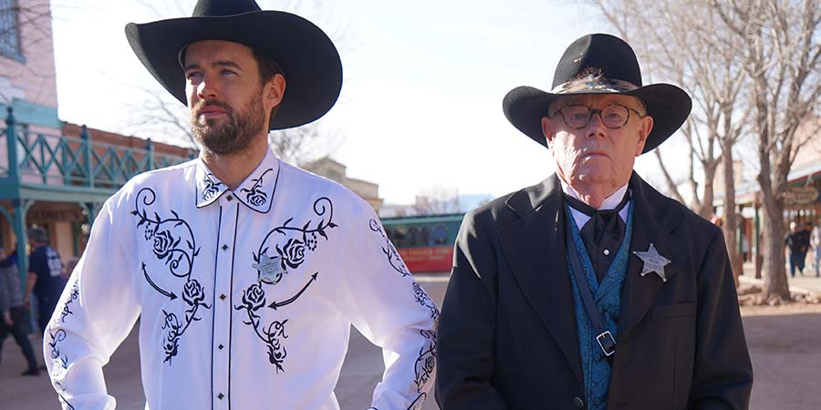 two men in cowboy outfits