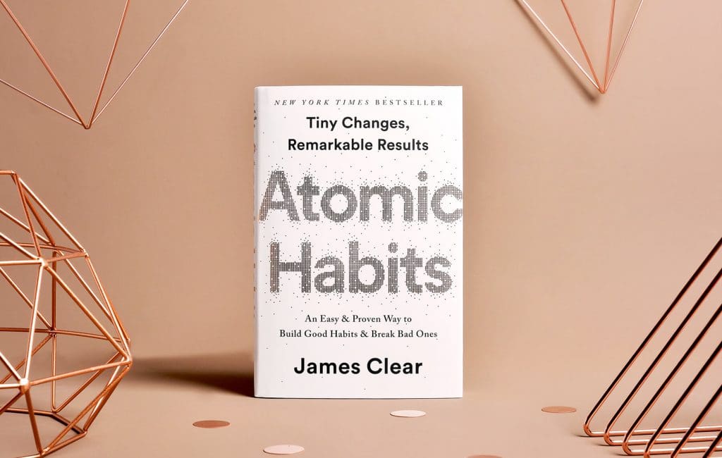 Atomic Habits written by James Clear