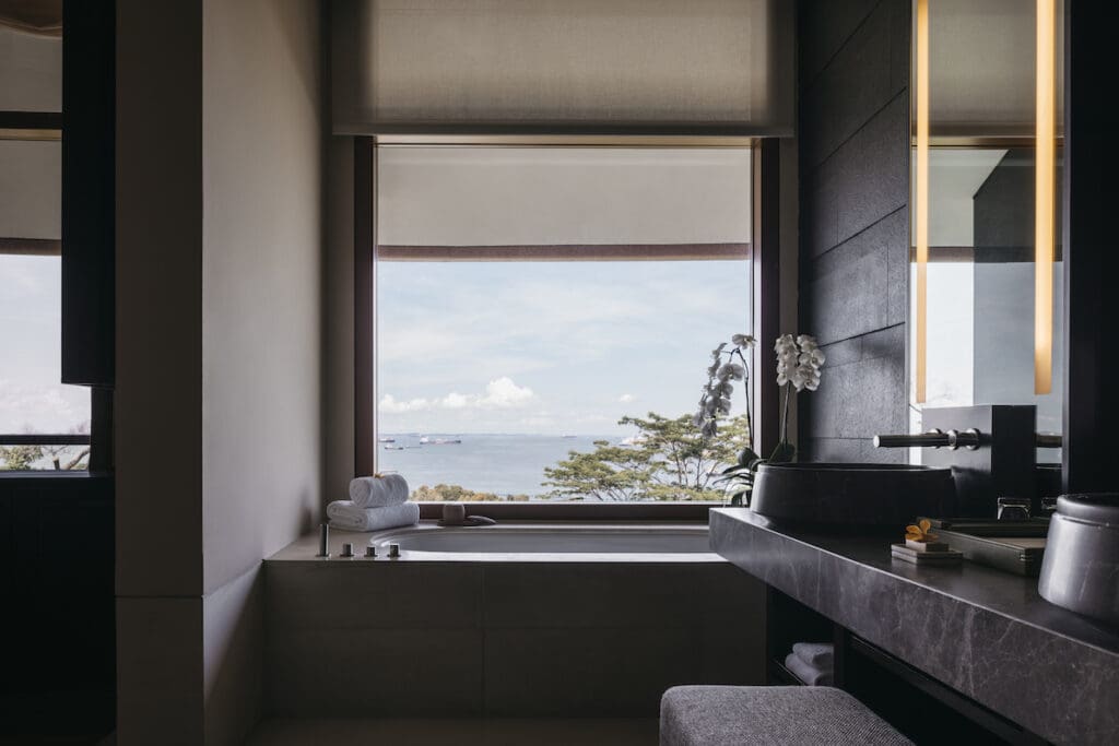 hotel window above the spa bath with views of the ocean.